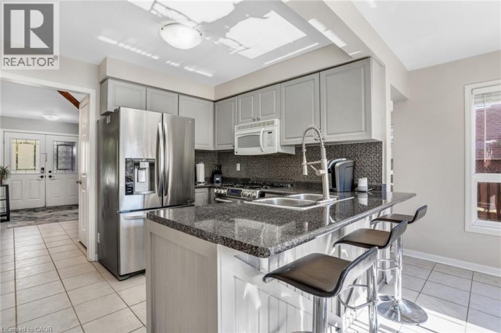 Photo 14 at 795 Saginaw Parkway, Cambridge